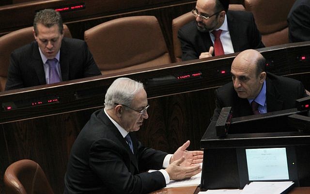 Prime Minister Benjamin Netanyahu speaks with Kadima chairman Shaul Mofaz in the Knesset plenum on June 4, 2012. (photo credit: Miriam Alster/Flash90) Prime Minister Benjamin Netanyahu speaks with Kadima chairman Shaul Mofaz in the Knesset plenum on June 4, 2012. (photo credit: Miriam Alster/Flash90)