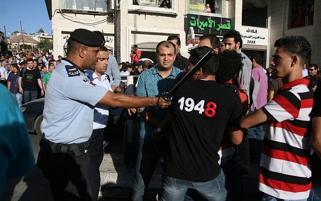 Protesters clash with police in Ramallah Sunday (photo credit: Issam Rimawi/FLASH90) Protesters clash with police in Ramallah Sunday (photo credit: Issam Rimawi/FLASH90)