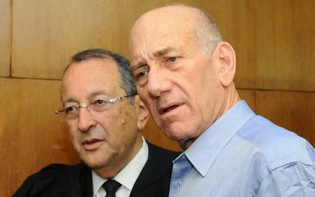 Former prime minister Ehud Olmert (right) with his attorney at the Tel Aviv District Court in early July (photo credit: Yossi Zeliger/Flash90)