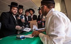 Ultra-Orthodox men receiving information at their civil service orientation in Jerusalem in July 2012. (photo credit: Uri Lenz/Flash 90)