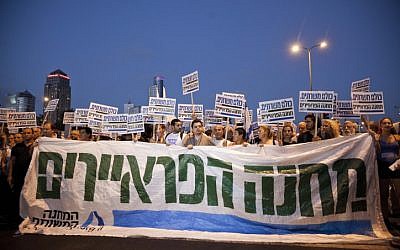 Tens of thousands of people hold a mass rally in Tel Aviv, on Saturday, urging the government to enact universal draft legislation (photo credit: Tali Mayer/Flash90)