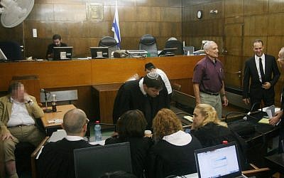 The state's witness, whose identity is under gag order, giving testimony in the Holyland trial last week. (photo credit: Roni Schutzer/Flash90)
