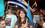Daphni Leef, one of the leaders of the social justice protest movement, with other demonstrators in September (photo credit: Roni Schutzer/Flash90)