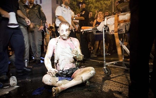 Moshe Silman set himself on fire and severely burned himself during a protest march against soaring prices of living, in Tel Aviv on July 14, 2012 (photo credit: Tali Mayer/Flash90)