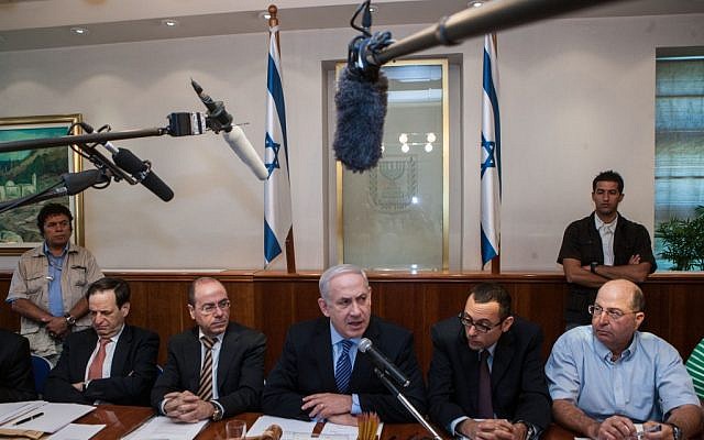 Benjamin Netanyahu, center, speaking to the press in mid-July. (photo credit: Uri Lenz/Flash90)