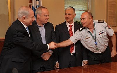 Israeli prime minister Benjamin Netanyahu, Finance Minister Yuval Steinitz and Minister of Public Security Yitzhak Aharonovitch sign an agreement with the The Israel Fire and Rescue Services Monday (photo credit: Moshe Milner/Flash90)
