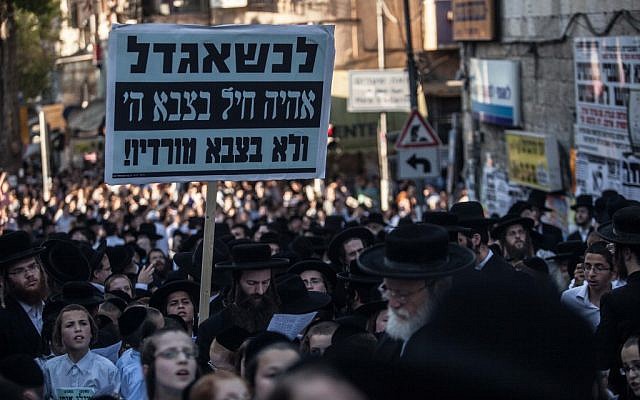 "When I grow up, I'll be a soldier in the Army of God, not in an army of disbelievers", a sign held up at a recent rally (photo credit: Uri Lenz/Flash 90) "When I grow up, I'll be a soldier in the Army of God, not in an army of disbelievers", a sign held up at a recent rally (photo credit: Uri Lenz/Flash 90)