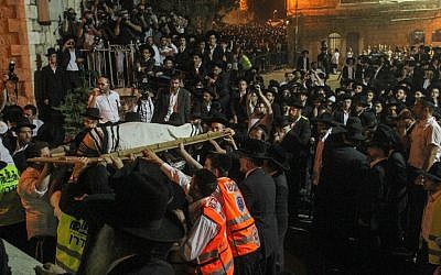 Throngs of ultra-Orthodox Jews attend the funeral of Rabbi Yosef Shalom Elyashiv in Jerusalem on Wednesday night, July 18, 2012. (photo credit: Uri Lenz/Flash90)