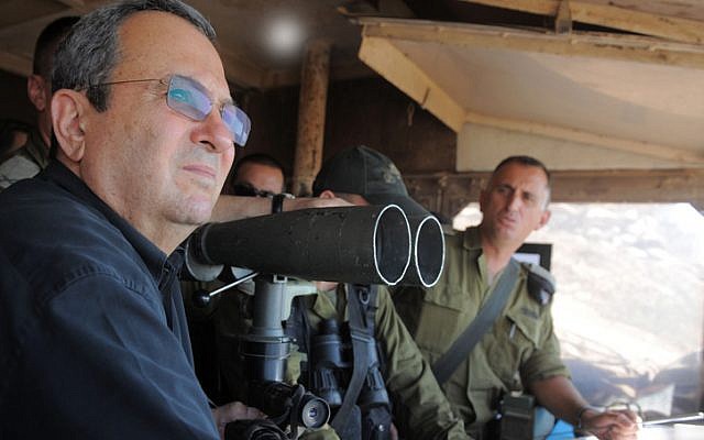 Defence Minister Ehud Barak visits the IDF Northern Command Unit on the Golan Heights, near Syria, July 19, 2012. Images of Barak observing a a battle between the Syrian Army and rebel forces has prompted a wave of sight-seers looking for action. (photo credit: Minisry of Defence/FLASH90)