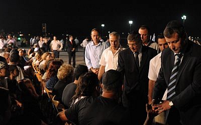 Tourism Minister Stas Misezhnikov attends a ceremony for Israeli victims of  the Burgas terror attack, at Ben Gurion Airport on Friday, July 20 (photo credit: Amos Ben Gershom/GPO/Flash90)