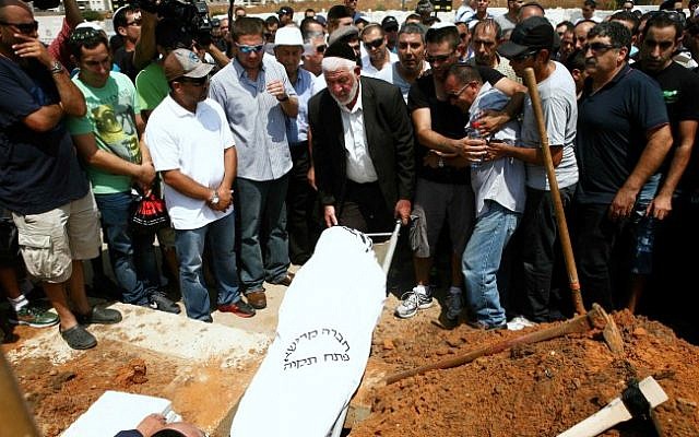 Friends and family mourn at the funeral of Itzik Kolengi, 27, at Petah Tikva’s Segula cemetery on Friday. (photo credit: Yehoshua Yosef/FLASH90) Friends and family mourn at the funeral of Itzik Kolengi, 27, at Petah Tikva’s Segula cemetery on Friday. (photo credit: Yehoshua Yosef/FLASH90)