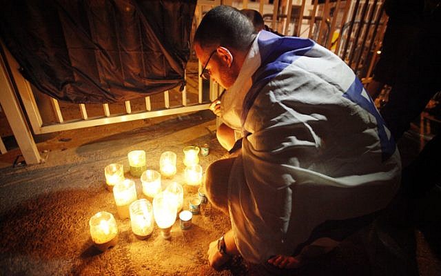 Israelis light candles in memory of 57-year old Moshe Silman, who passed away on July 20. Silman set himself on fire during a social protest in Tel Aviv last week, suffering 3rd degree burns all over his body. (photo credit: Miriam Alster/Flash90) Israelis light candles in memory of 57-year old Moshe Silman, who passed away on July 20. Silman set himself on fire during a social protest in Tel Aviv last week, suffering 3rd degree burns all over his body. (photo credit: Miriam Alster/Flash90)