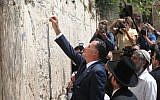 Mitt Romney during a visit to Jerusalem's Western Wall in July (photo credit: Yossi Zamir/Flash 90)