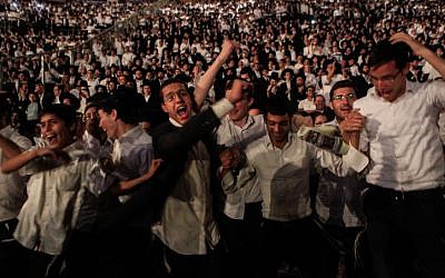 Thousands of ultra-Orthodox Jews celebrate the completion of the seven-year Daf Yomi cycle -- the learning of the entirety of the Talmud, one day at a time -- at Jerusalem’s Teddy Stadium on Monday, July 30, 2012.  (photo credit: Uri Lenz/Flash90)
