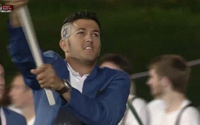 Flag bearer Shahar Zubari, who won an Olympic bronze medal in sailing in 2008, sports a flag-inspired haircut as he marches the Israeli team into the Olympic Stadium at the opening ceremony of the 2012 London Games, Friday, July 28 (image capture Channel 1)