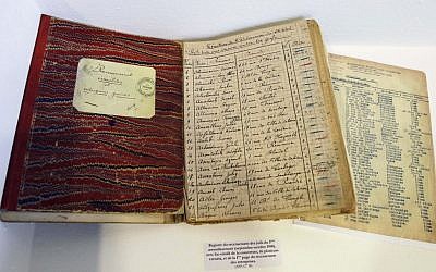 Lists of Jewish people registered by French authorities during WWII, from the Archives of Paris Police Prefecture (photo credit: Remy de la Mauviniere/AP)