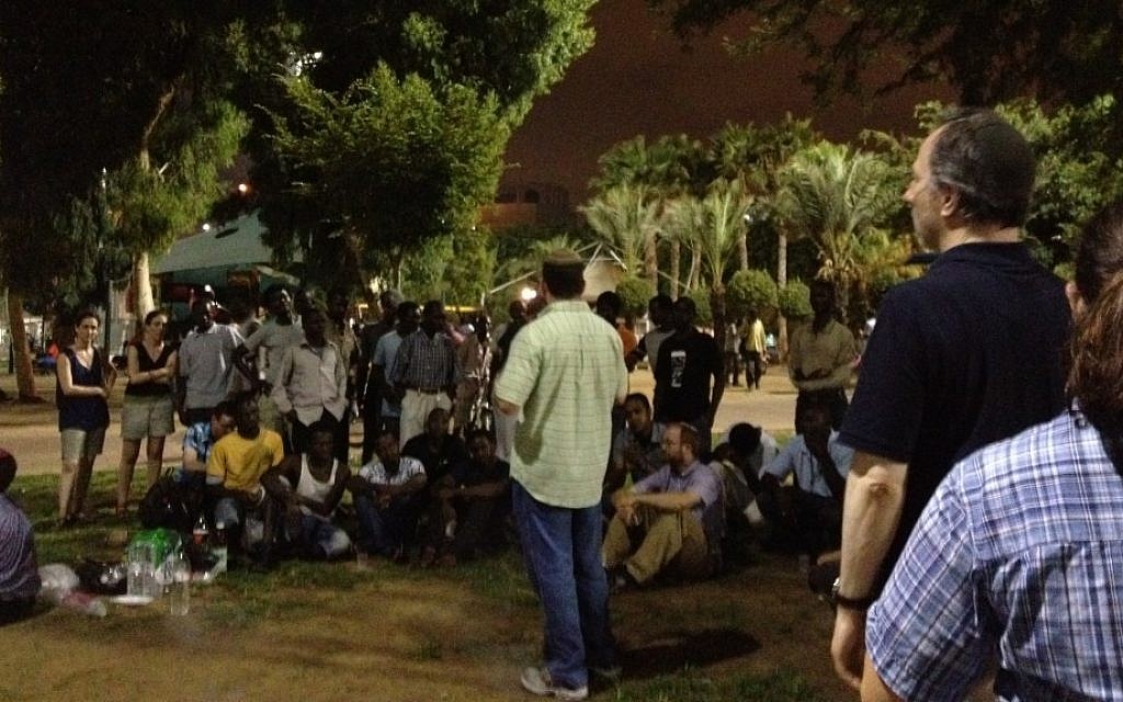 Aaron Frazer speaking at the Livnota b'esh (build it by fire) barbecue to promote conversations between African refugees and Israelis at the Levinsky Park Thursday (photo credit: MIchal Shmulovich) Aaron Frazer speaking at the Livnota b'esh (build it by fire) barbecue to promote conversations between African refugees and Israelis at the Levinsky Park Thursday (photo credit: MIchal Shmulovich)