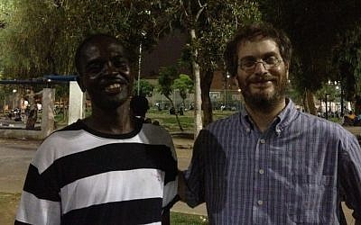 New friends Abu Bakr Abu Karim (left) and Elli Fischer at the Levinsky Park Thursday (photo credit: Michal Shmulovich) New friends Abu Bakr Abu Karim (left) and Elli Fischer at the Levinsky Park Thursday (photo credit: Michal Shmulovich)