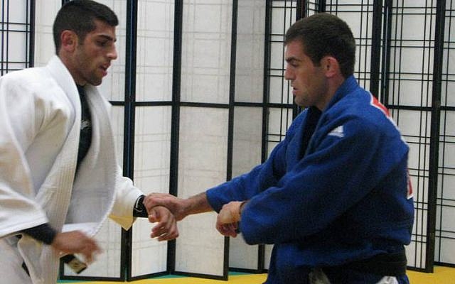 Israeli judokas practice on their side of the barrier, seperated from the Lebanese athletes (photo credit: courtesy of the Israeli Olympic Committee) Israeli judokas practice on their side of the barrier, seperated from the Lebanese athletes (photo credit: courtesy of the Israeli Olympic Committee)