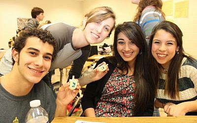 Modeling excellence? Baltimore High School students engaging in the Teens Can Identify program, which supports Jewish life and learning in local non-Jewish independent schools. (courtesy TCI program of The Louise D. and Morton J. Macks Center for Jewish Education in Baltimore/JTA)