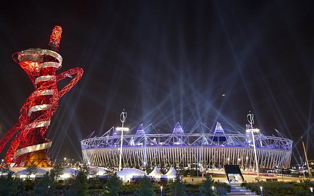 Searchlights shine over the Olympic Stadium during a rehearsal for the opening ceremony at the 2012 Summer Olympics, Wednesday in London. (photo credit: AP/Ben Curtis) Searchlights shine over the Olympic Stadium during a rehearsal for the opening ceremony at the 2012 Summer Olympics, Wednesday in London. (photo credit: AP/Ben Curtis)