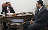 Prime Minister Hisham Kandil meeting with President Mohammed Morsi in Cairo, July 2012 (photo credit: AP Photo/Ahmed Mourad)