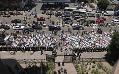 Hundreds of Muslim Brotherhood supporters pray during a demonstration outside the State Council in Cairo, Egypt. (photo credit: AP/Amr Nabil)