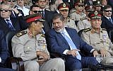 Mohammed Morsi (center) talks with Field Marshal Hussein Tantawi (photo credit:Sheriff Abd El Minoem, Egyptian Presidency/AP)