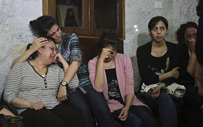 Palestinian Christians cry during a rally against the forced conversions of two individuals. (photo credit: AP/Adel Hana)