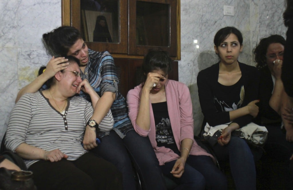 Palestinian Christians cry during a rally against the forced conversions of two individuals on Monday (photo credit: AP/Adel Hana) Palestinian Christians cry during a rally against the forced conversions of two individuals on Monday (photo credit: AP/Adel Hana)