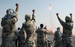 Members of the Iranian Revolutionary Guards Corp celebrate after a missile launch in July 2012 (AP/IRNA, Mostafa Qotbi)