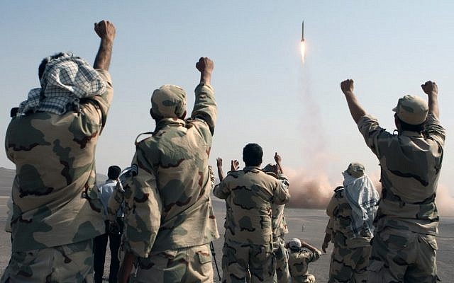 Members of the Iranian Revolutionary Guards Corp celebrate after a missile launch in July 2012 (AP/IRNA, Mostafa Qotbi)