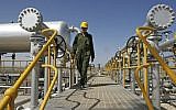 File: A technician in an oil field southwest of Tehran. (AP/Vahid Salemi)