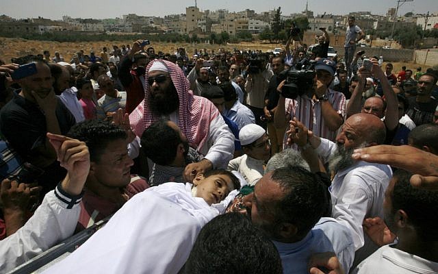 People carry the body of 6-year-old Syrian boy Bilal El-Lababidi during his funeral in Ramtha, Jordan, Friday, July 27, 2012. The boy was shot dead by Syrian border guards, his mother said. (Photo credit: AP/Mohammad Hannon) People carry the body of 6-year-old Syrian boy Bilal El-Lababidi during his funeral in Ramtha, Jordan, Friday, July 27, 2012. The boy was shot dead by Syrian border guards, his mother said. (Photo credit: AP/Mohammad Hannon)