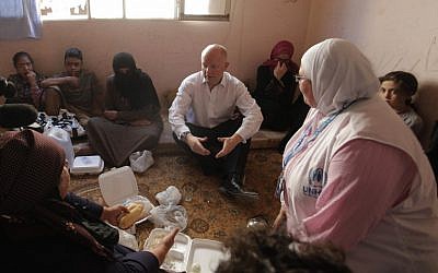 British Foreign Secretary William Hague meets with Syrian refugees in Ramtha, Jordan on Tuesday (photo credit: AP/Mohammad Hannon)