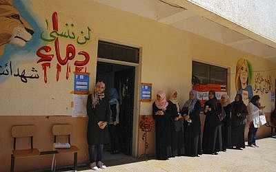 Women stand in line to vote in Benghazi in 2012 (photo credit: AP Photo/Ibrahim Alaguri)