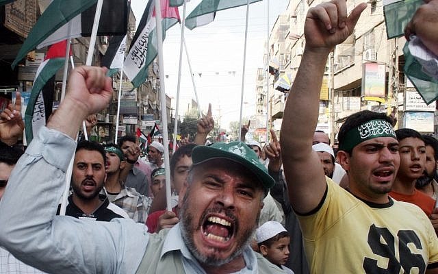 Syrian demonstrators march through the Yarmouk Palestinian refugee camp, near Damascus, to mark Jerusalem Day, in 2007. (photo credit: AP/Bassem Tellawi) Syrian demonstrators march through the Yarmouk Palestinian refugee camp, near Damascus, to mark Jerusalem Day, in 2007. (photo credit: AP/Bassem Tellawi)