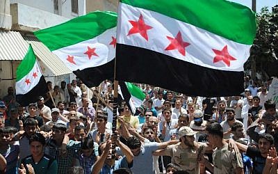 Syrian opposition protesters in Idlib, June 29 (photo credit: AP photo) Syrian opposition protesters in Idlib, June 29 (photo credit: AP photo)