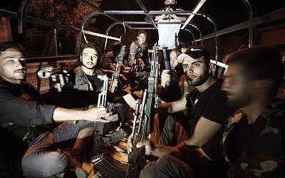 Free Syrian Army soldiers are seen at the border town of Azaz, some 20 miles (32 kilometers) north of Aleppo, Syria. (Turkpix/AP)