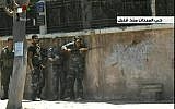 Syrian troops clash with rebels in Damascus' Midan neighborhood in July 2012. (AP Photo/SANA via AP video)