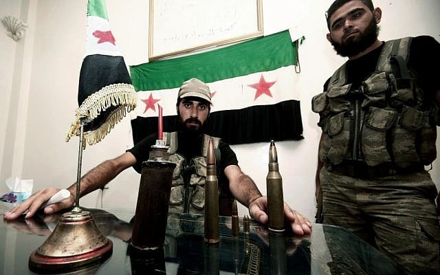 Free Syrian Army soldiers are seen in the Syrian border town of Azaz, north of Aleppo (photo credit: AP/Turkpix) Free Syrian Army soldiers are seen in the Syrian border town of Azaz, north of Aleppo (photo credit: AP/Turkpix)