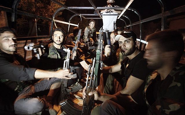 Free Syrian Army soldiers in the border town of Azaz, north of Aleppo, Sunday (photo credit: AP photo/Turkpix) Free Syrian Army soldiers in the border town of Azaz, north of Aleppo, Sunday (photo credit: AP photo/Turkpix)