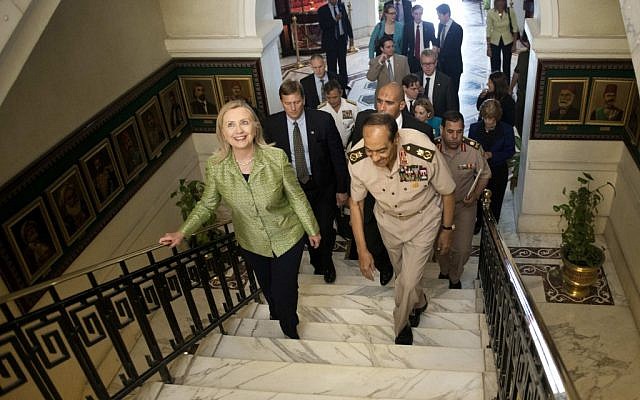 Field Marshal Hussein Tantawi walks with US Secretary of State Hillary Rodham Clinton to a meeting at the Ministry of Defense on Sunday, July 15, in Cairo, Egypt (photo credit: AP/Brendan Smialowski)