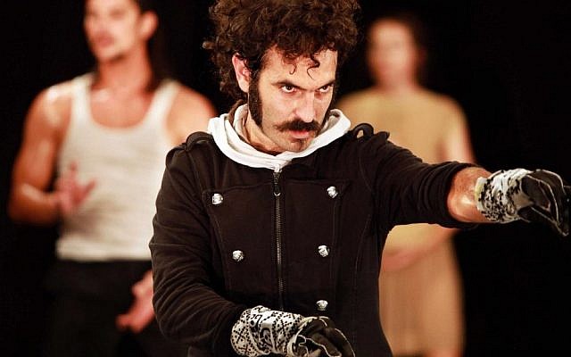 Ori Ben-Shabat, wearing a pair of digital gloves at a performance (Photo credit: Marijn Alders)