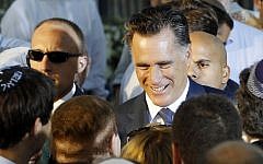 Republican presidential candidate and former Massachusetts Gov. Mitt Romney talks to American businessman Sheldon Adelson, who has said he will donate millions to Romney's campaign, after he delivered a speech in Jerusalem, Sunday, July 29 (photo credit: AP/Charles Dharapak)