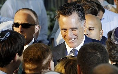 Republican presidential candidate and former Massachusetts Gov. Mitt Romney talks to American businessman Sheldon Adelson, who has said he will donate millions to Romney's campaign, after he delivered a speech in Jerusalem, Sunday, July 29 (photo credit: AP/Charles Dharapak)