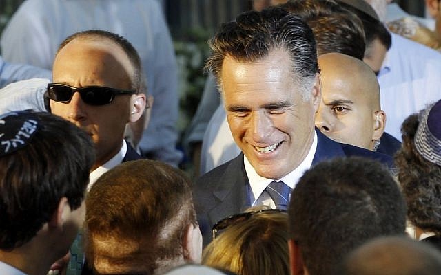 Republican presidential candidate and former Massachusetts Gov. Mitt Romney talks to American businessman Sheldon Adelson, who has said he will donate millions to Romney's campaign, after he delivered a speech in Jerusalem, Sunday, July 29 (photo credit: AP/Charles Dharapak)