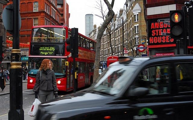 A woman waits at a traffic light in one of London's busiest streets. (Photo credit: Gili Yaari/Flash90) A woman waits at a traffic light in one of London's busiest streets. (Photo credit: Gili Yaari/Flash90)