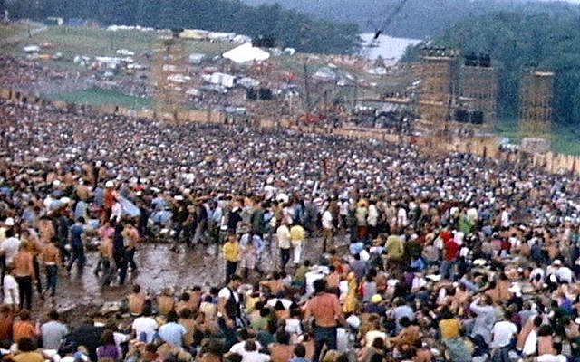 The crowd at Woodstock fills a natural amphitheatre with the stage at the bottom, August 1969 (photo credit: Derek Redmond and Paul Campbell/CCA-SA 3.0)