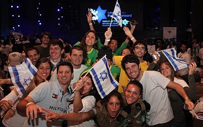 Young Jews from all over the world participating in the Taglit Birthright program at an event held at the International Conference Center in Jerusalem, Janurary 2012. Taglit-Birthright is a free 10-day educational trip offered to Jews age 18 to 26. (photo credit: Marc Israel Sellem Flash90)